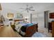Cozy bedroom with wooden furniture and ceiling fan at 8142 Coco Solo Ave, North Port, FL 34287