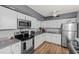 Modern kitchen featuring white shaker cabinets and granite countertops at 8142 Coco Solo Ave, North Port, FL 34287