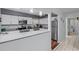 Kitchen with white cabinets, granite countertops, and stainless steel appliances at 8142 Coco Solo Ave, North Port, FL 34287