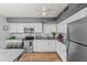 Kitchen with white cabinets, granite countertops, and stainless steel appliances at 8142 Coco Solo Ave, North Port, FL 34287