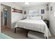 Bedroom with a king-size bed and access to a bathroom at 9008 Allapata Ln, Venice, FL 34293