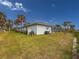 Single story home with a spacious lawn and screened patio at 9008 Allapata Ln, Venice, FL 34293