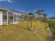 Relaxing pool area with screened enclosure and lush landscaping at 9008 Allapata Ln, Venice, FL 34293