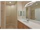 Bathroom features a single sink and a shower at 9435 Discovery Ter # 202D, Bradenton, FL 34212