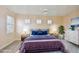 Virtually staged bedroom with a dresser and ceiling fan at 9435 Discovery Ter # 202D, Bradenton, FL 34212