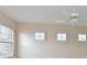 Bedroom with plantation shutters and ceiling fan at 9435 Discovery Ter # 202D, Bradenton, FL 34212