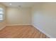 Spacious bedroom with hardwood floors and neutral walls at 9435 Discovery Ter # 202D, Bradenton, FL 34212