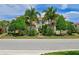 Two-story home with palm trees and lush landscaping at 9435 Discovery Ter # 202D, Bradenton, FL 34212