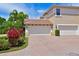 Two-car garage with brick paver driveway and landscaping at 9435 Discovery Ter # 202D, Bradenton, FL 34212