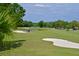Stunning view of the golf course with pond and sand trap at 9435 Discovery Ter # 202D, Bradenton, FL 34212