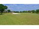 Green golf course with sand trap and lush fairways at 9435 Discovery Ter # 202D, Bradenton, FL 34212