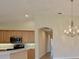 Bright hallway with arched doorways and tile flooring at 9435 Discovery Ter # 202D, Bradenton, FL 34212