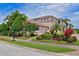 Beautiful two-story home with lush landscaping and brick driveway at 9435 Discovery Ter # 202D, Bradenton, FL 34212