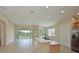 Open concept kitchen with breakfast bar and stainless steel appliances at 9435 Discovery Ter # 202D, Bradenton, FL 34212