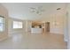 Open kitchen with island, stainless steel appliances, and light wood cabinets at 9435 Discovery Ter # 202D, Bradenton, FL 34212