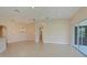 Large living room with tile floors and lots of natural light at 9435 Discovery Ter # 202D, Bradenton, FL 34212