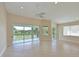 Bright living room with access to balcony and golf course view at 9435 Discovery Ter # 202D, Bradenton, FL 34212