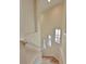 Light-filled staircase with hardwood steps and neutral walls at 9435 Discovery Ter # 202D, Bradenton, FL 34212