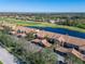 Aerial view showing condo location near golf course and lake at 1003 Fairwaycove Ln # 101, Bradenton, FL 34212