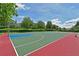 Outdoor basketball court with green and blue surface at 1003 Fairwaycove Ln # 101, Bradenton, FL 34212