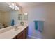 Bathroom with double vanity and a large mirror at 1003 Fairwaycove Ln # 101, Bradenton, FL 34212