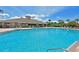 Resort-style community pool with a large deck area at 1003 Fairwaycove Ln # 101, Bradenton, FL 34212