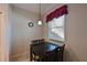 Small dining area with a table and four chairs near a window at 1003 Fairwaycove Ln # 101, Bradenton, FL 34212