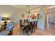 Bright dining room with glass table and wicker chairs at 1003 Fairwaycove Ln # 101, Bradenton, FL 34212