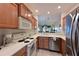 Well-equipped kitchen featuring stainless steel appliances and ample cabinetry at 1003 Fairwaycove Ln # 101, Bradenton, FL 34212