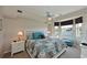 Spacious main bedroom with water views and ceiling fan at 1003 Fairwaycove Ln # 101, Bradenton, FL 34212