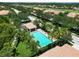 Community pool with a relaxing patio area at 1003 Fairwaycove Ln # 101, Bradenton, FL 34212