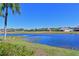 Stunning view of a lake and golf course from a peaceful waterfront setting at 1003 Fairwaycove Ln # 101, Bradenton, FL 34212