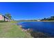 Breathtaking view of a tranquil lake and lush landscaping at 1003 Fairwaycove Ln # 101, Bradenton, FL 34212