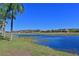 Scenic view of a peaceful lake and golf course at 1003 Fairwaycove Ln # 101, Bradenton, FL 34212