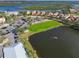 Aerial view of community, featuring a lake and homes at 10309 Riverbank Ter, Bradenton, FL 34212