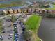 Aerial view of community with lake and parking at 10309 Riverbank Ter, Bradenton, FL 34212