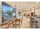 Breakfast nook with a glass-top table and built-in window seat at 10309 Riverbank Ter, Bradenton, FL 34212