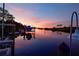 Peaceful waterfront sunset view with boat in canal at 10309 Riverbank Ter, Bradenton, FL 34212