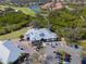 Aerial view of clubhouse with parking and golf course at 10309 Riverbank Ter, Bradenton, FL 34212