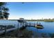 Private boat dock with lift and jet ski area at 10309 Riverbank Ter, Bradenton, FL 34212