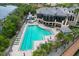 Lush landscaping surrounds the pool and clubhouse at 10309 Riverbank Ter, Bradenton, FL 34212