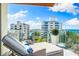 Balcony with lounge chairs and city view at 111 Golden Gate Pt # 401, Sarasota, FL 34236