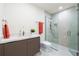 Modern bathroom with walk-in shower and updated vanity at 111 Golden Gate Pt # 401, Sarasota, FL 34236