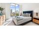 Cozy bedroom with city view and neutral tones at 111 Golden Gate Pt # 401, Sarasota, FL 34236