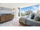 Spacious bedroom with city views and wood bed frame at 111 Golden Gate Pt # 401, Sarasota, FL 34236