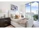 Stylish bedroom with city views and white bed frame at 111 Golden Gate Pt # 401, Sarasota, FL 34236