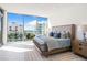 Main bedroom with water views and stylish decor at 111 Golden Gate Pt # 401, Sarasota, FL 34236