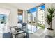 Modern glass dining table with city views at 111 Golden Gate Pt # 401, Sarasota, FL 34236