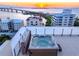 Relax in your private rooftop hot tub, overlooking stunning sunset views at 111 Golden Gate Pt # 401, Sarasota, FL 34236