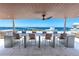 Spacious rooftop terrace with city and water views, seating, and hot tub at 111 Golden Gate Pt # 401, Sarasota, FL 34236